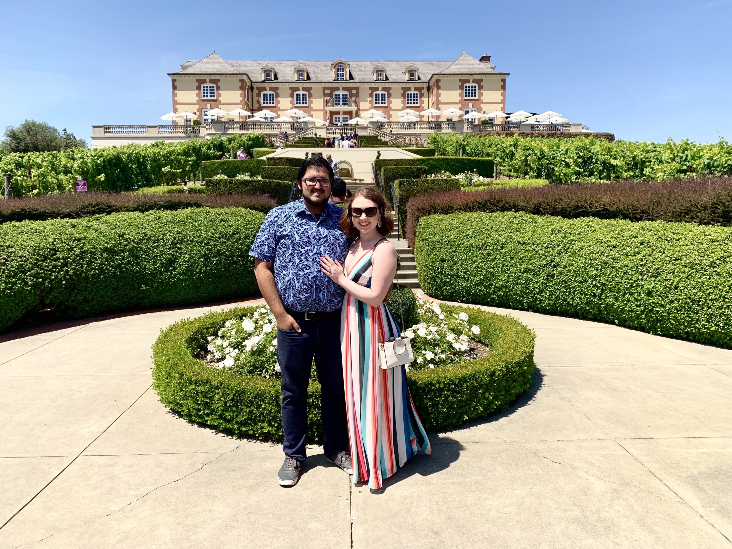 Couple in front of Domaine Carneros Winery on their Napa Valley Honeymoon