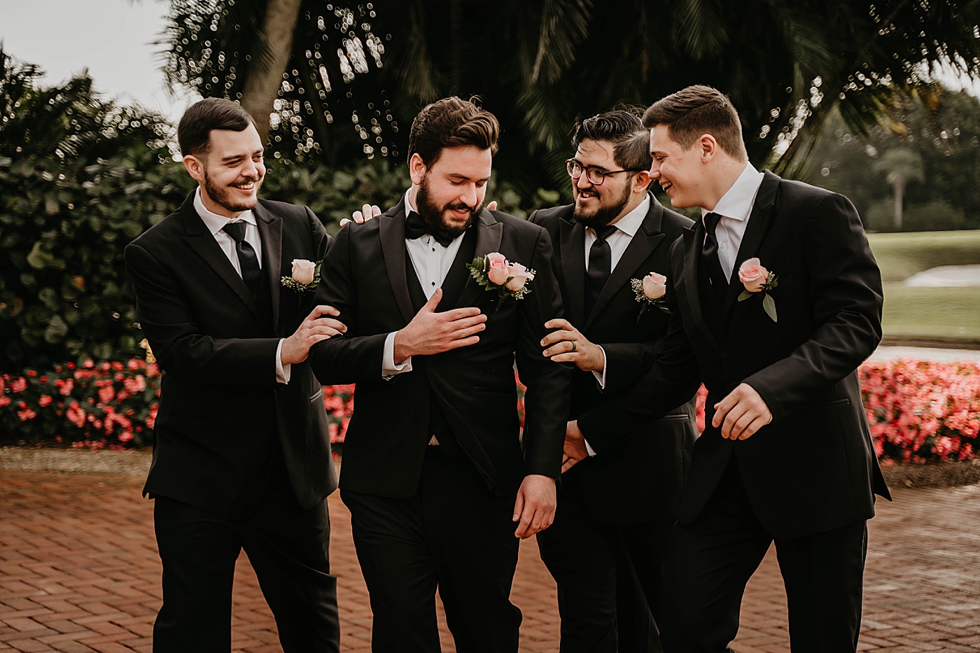 Groomsmen celebrating with Groom outside by golf course Romantic Winter Wedding captured NYC Wedding Planner Poppy and Lynn