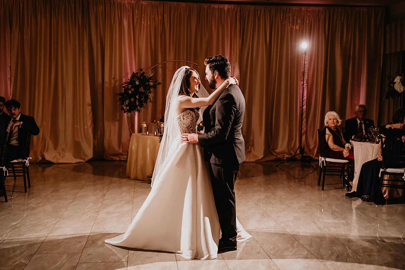 Bride and Groom laughing having fun during first dance at reception warm lighting Romantic Winter Wedding captured NYC Wedding Planner Poppy and Lynn