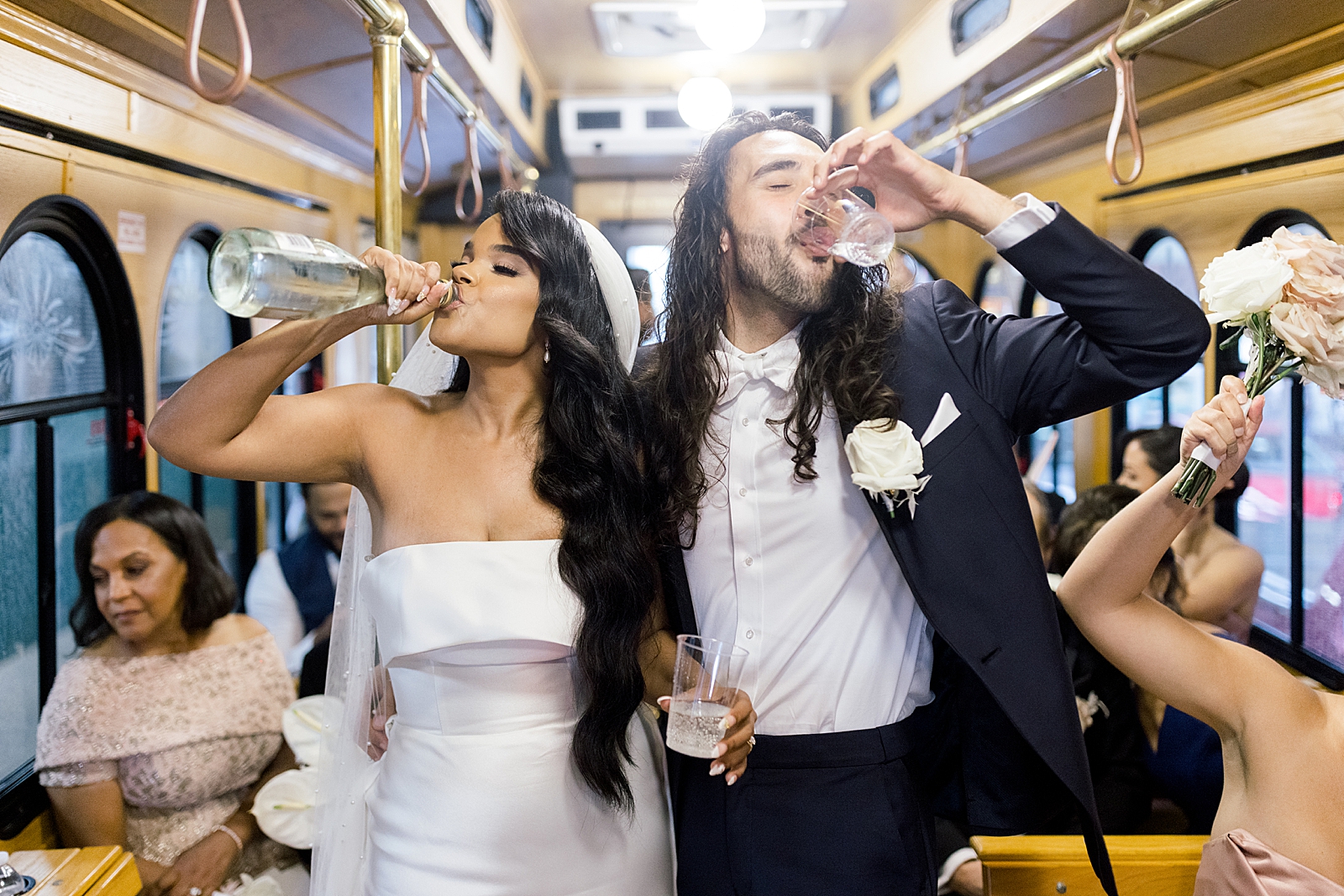 Bride and Groom having a drink of sparkling drink in trolley