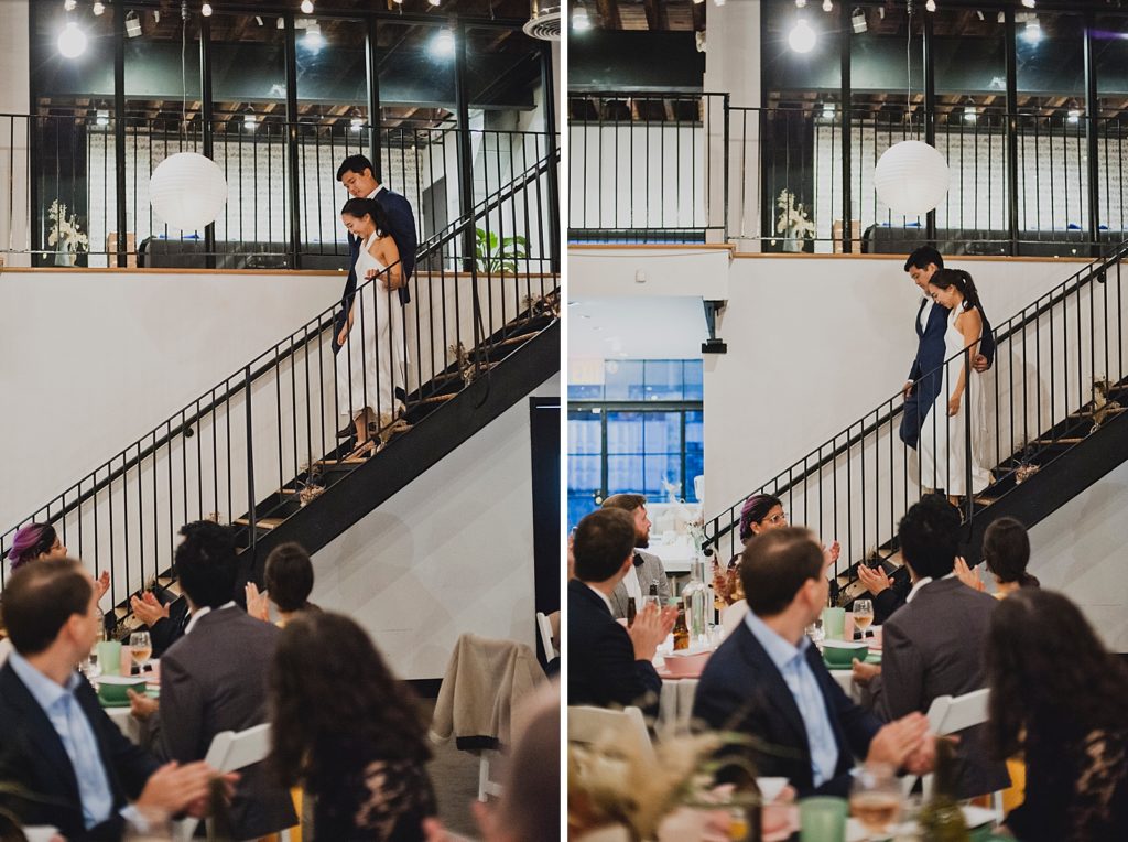 Just married Bride and Groom walking down indoor staircase for Reception
