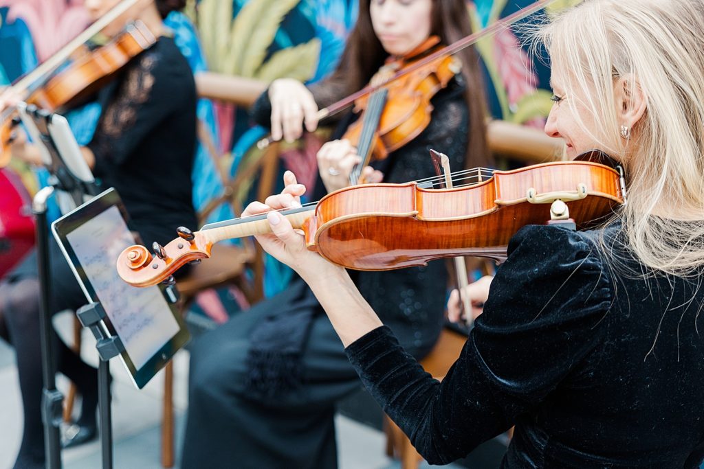 Closeup of Violinists playing for Ceremony