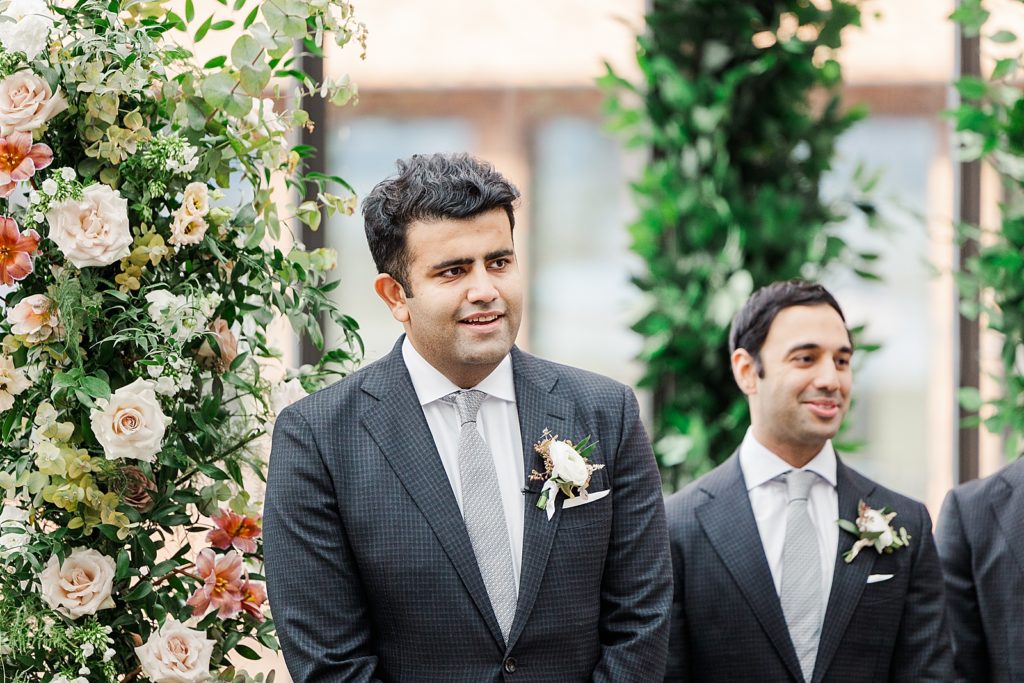 Groom's reaction to seeing bride walk down the aisle