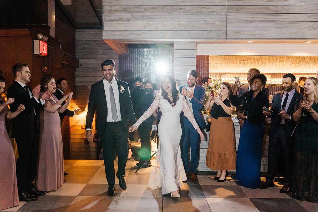 Bride and Groom entering Reception with clapping celebration