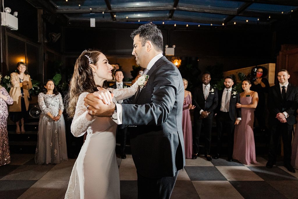 Bride and Groom holding hands out in formal coordinated first dance