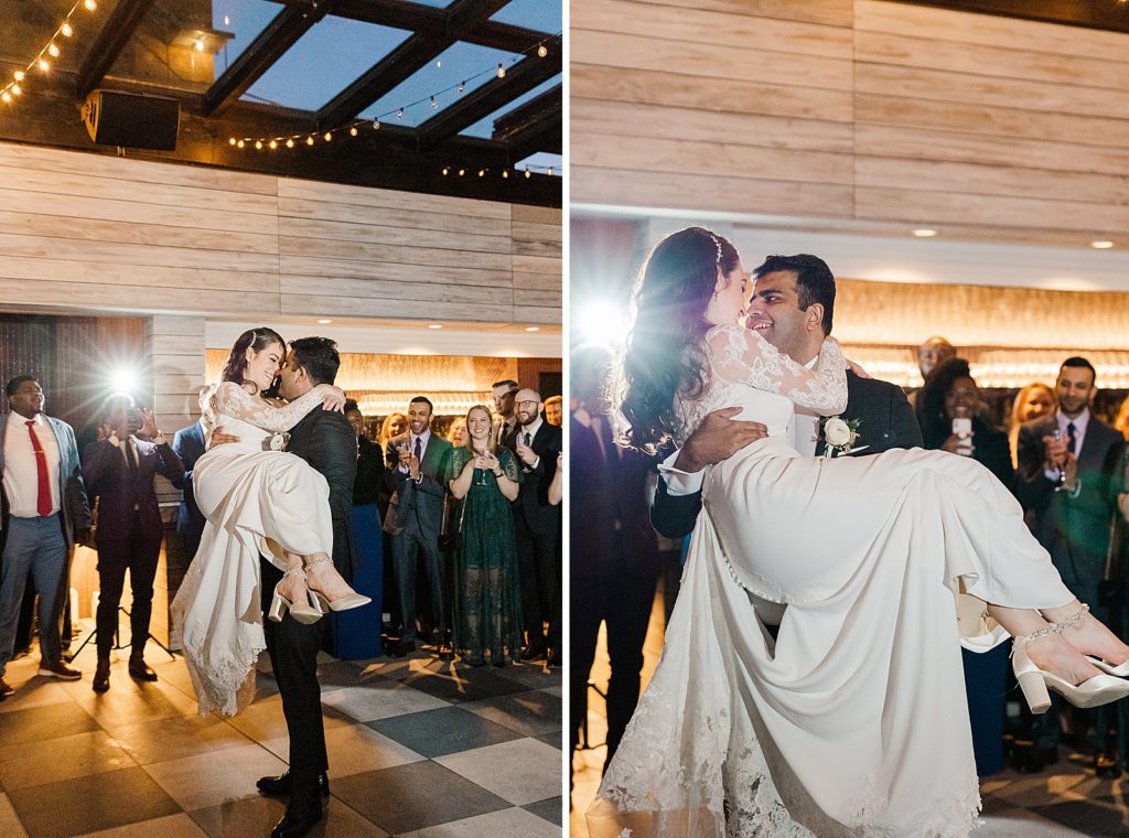 Groom holding Bride up in arms at end of First Dance