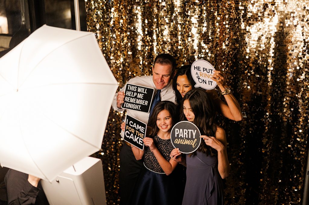 Family getting photo done at photo booth 