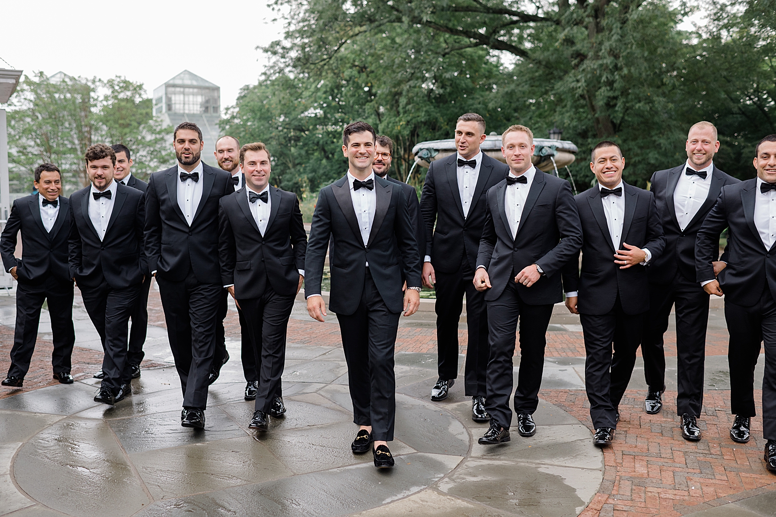 Shot of the groom and his groomsmen smiling for the camera.
