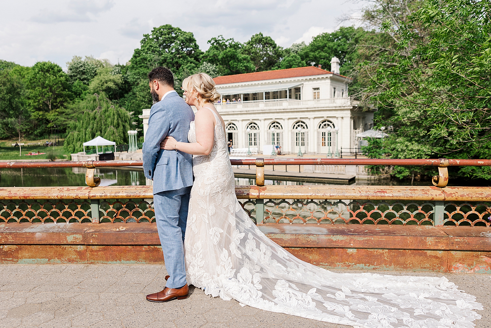 Shot of MK sneaking up behind Eliseo for their first look in front of Prospect Park Boathouse. 