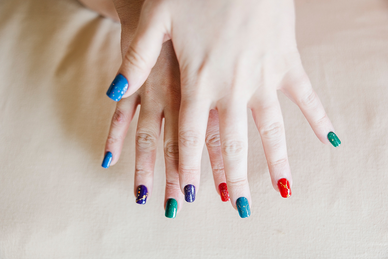 Photo of MK's multi-colored manicure. 