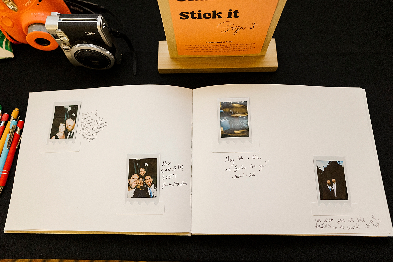 Photo of MK and Eliseo's guestbook filled with polaroids of guests and sweet hand written messages. 