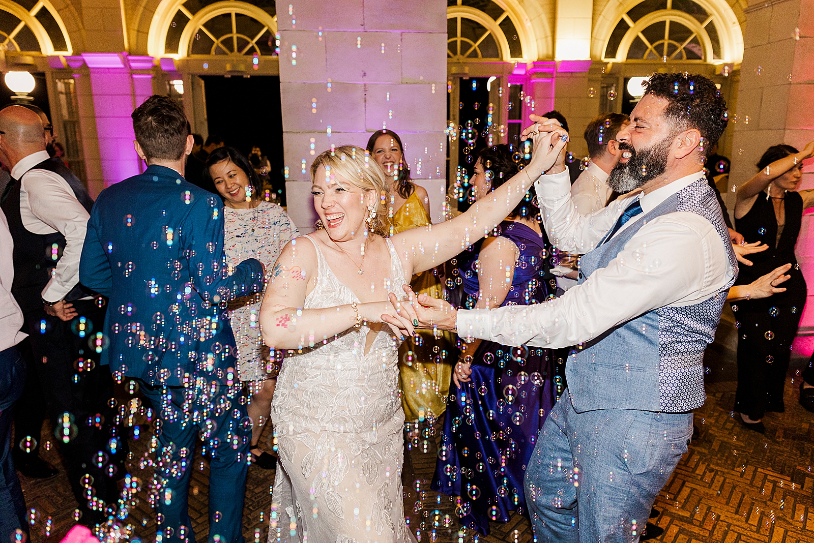Shot of MK and Eliseo dancing through bubbles during their reception. 