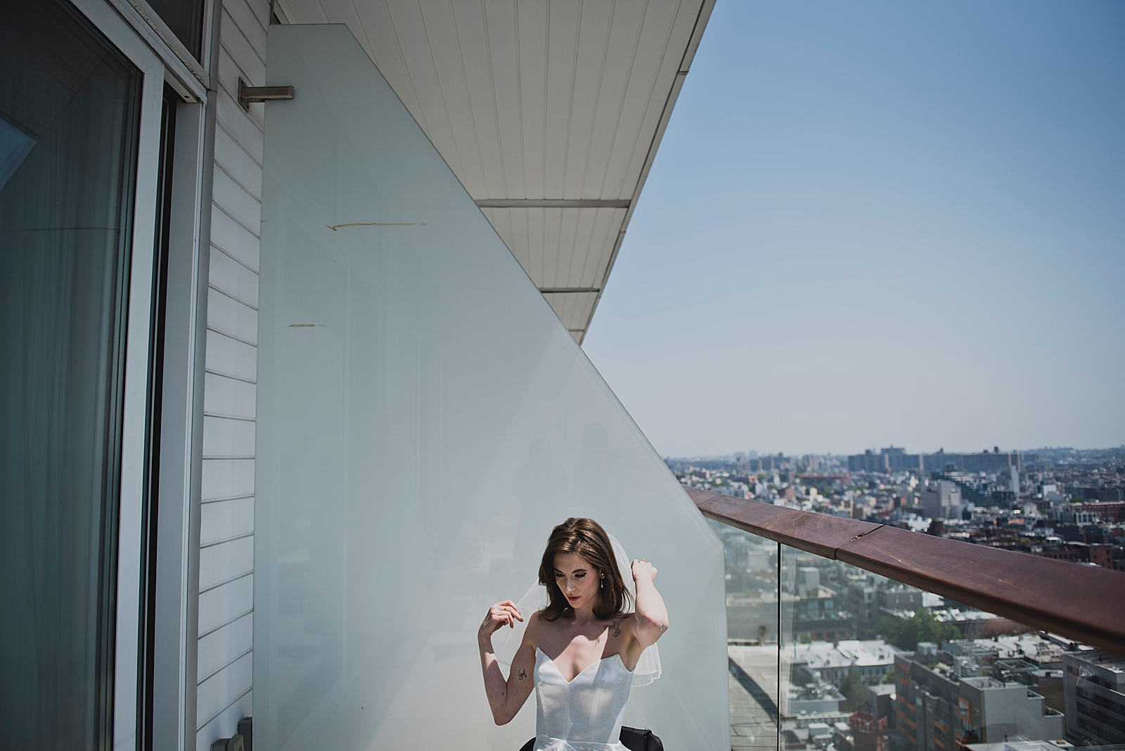 Upper body shot of the bride posing on a balcony. 