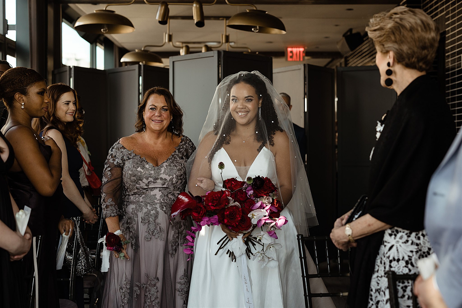 Shot of the Bride and her mother as they walk down the aisle. 