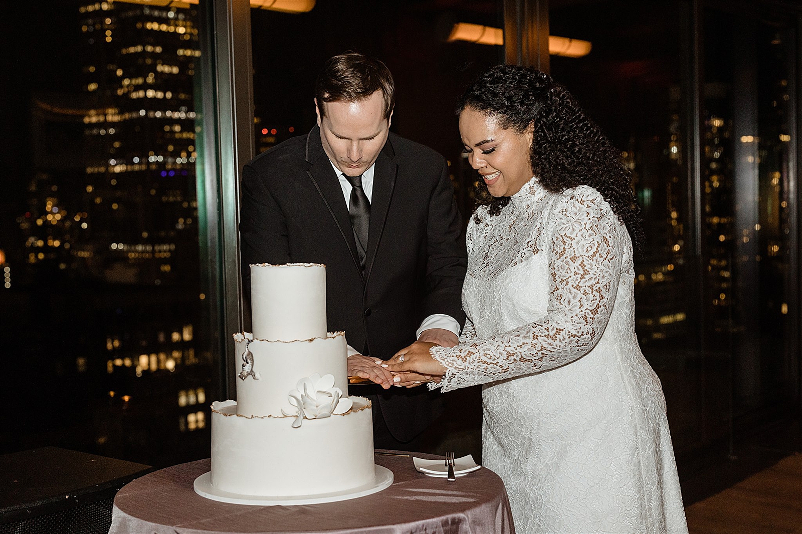 Shot of the Bride and Groom cutting their wedding cake. 