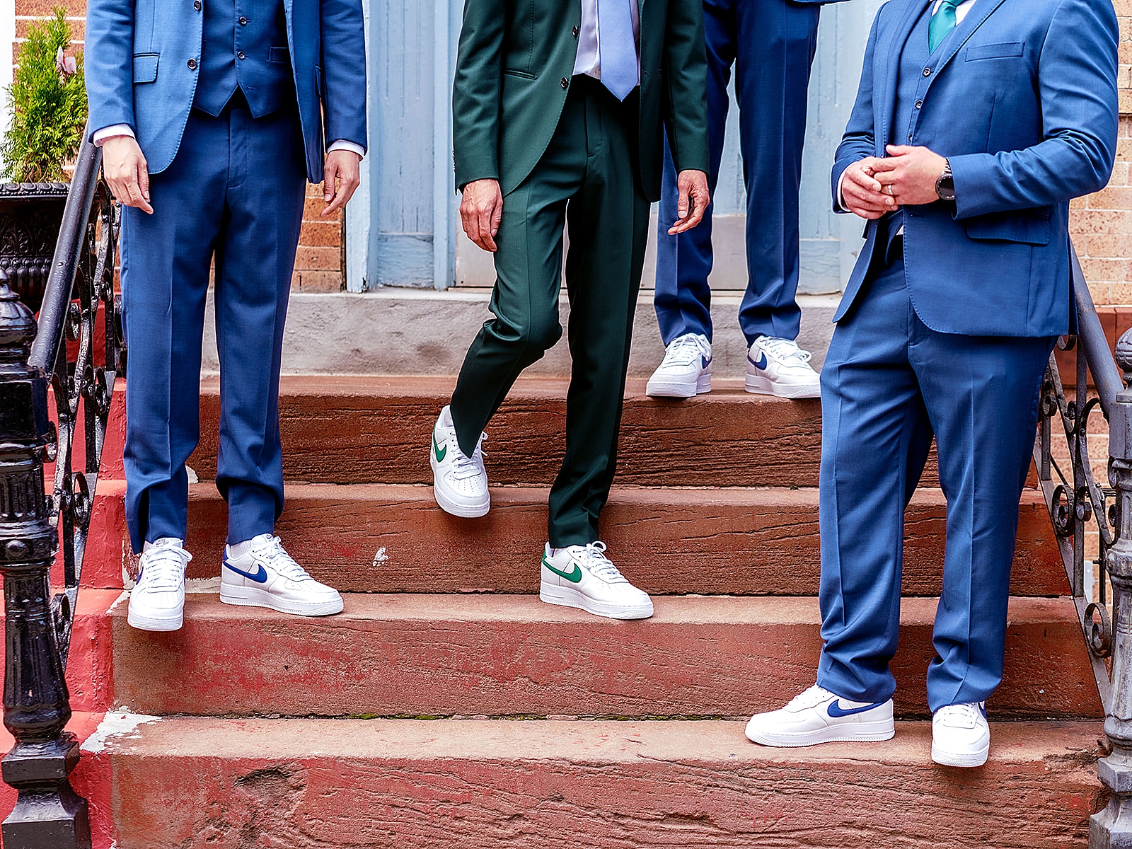 Horizontal shot of the groom and his groomsmen's matching sneakers. 