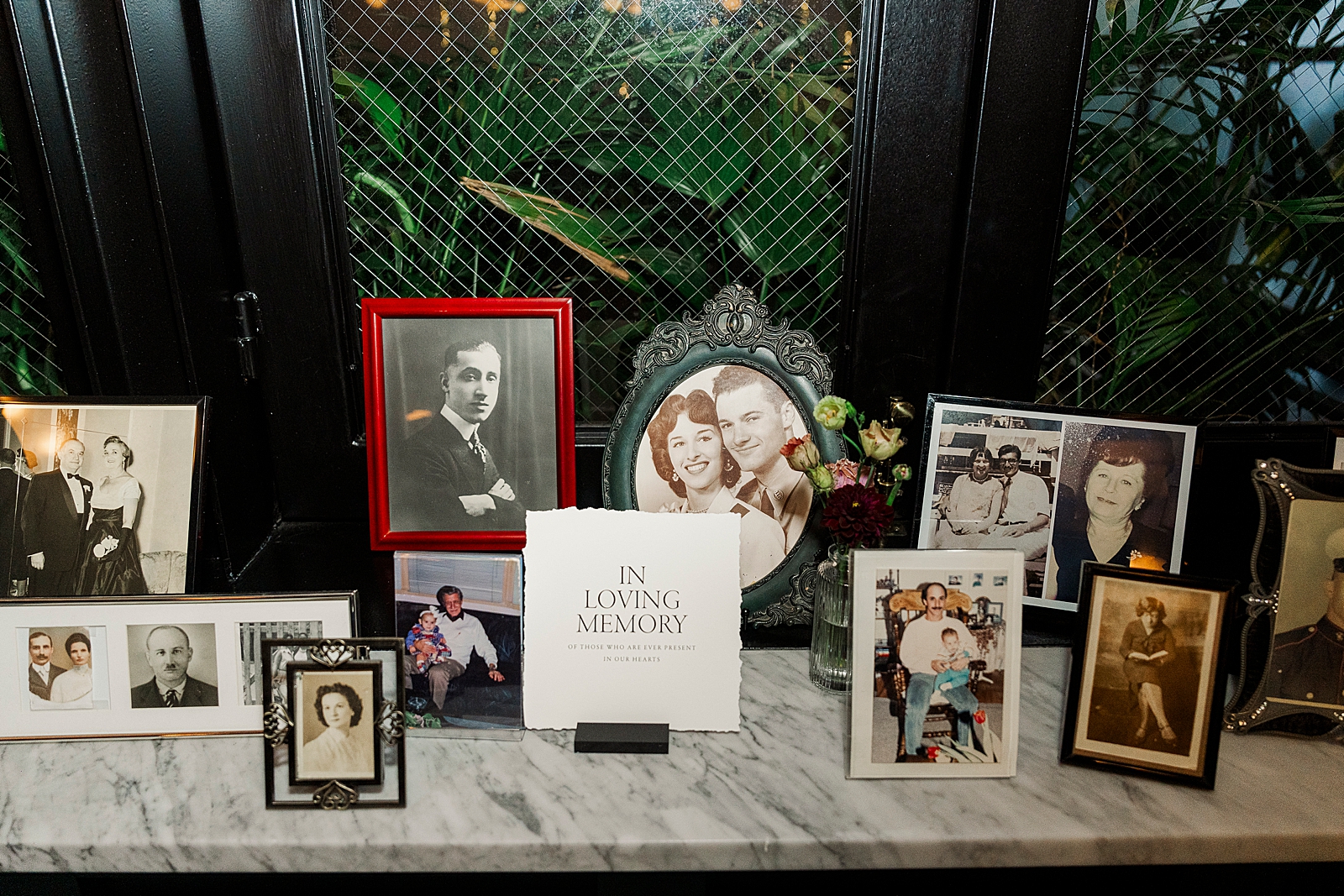 Shot of framed photos featuring the couple's lost loved ones. 