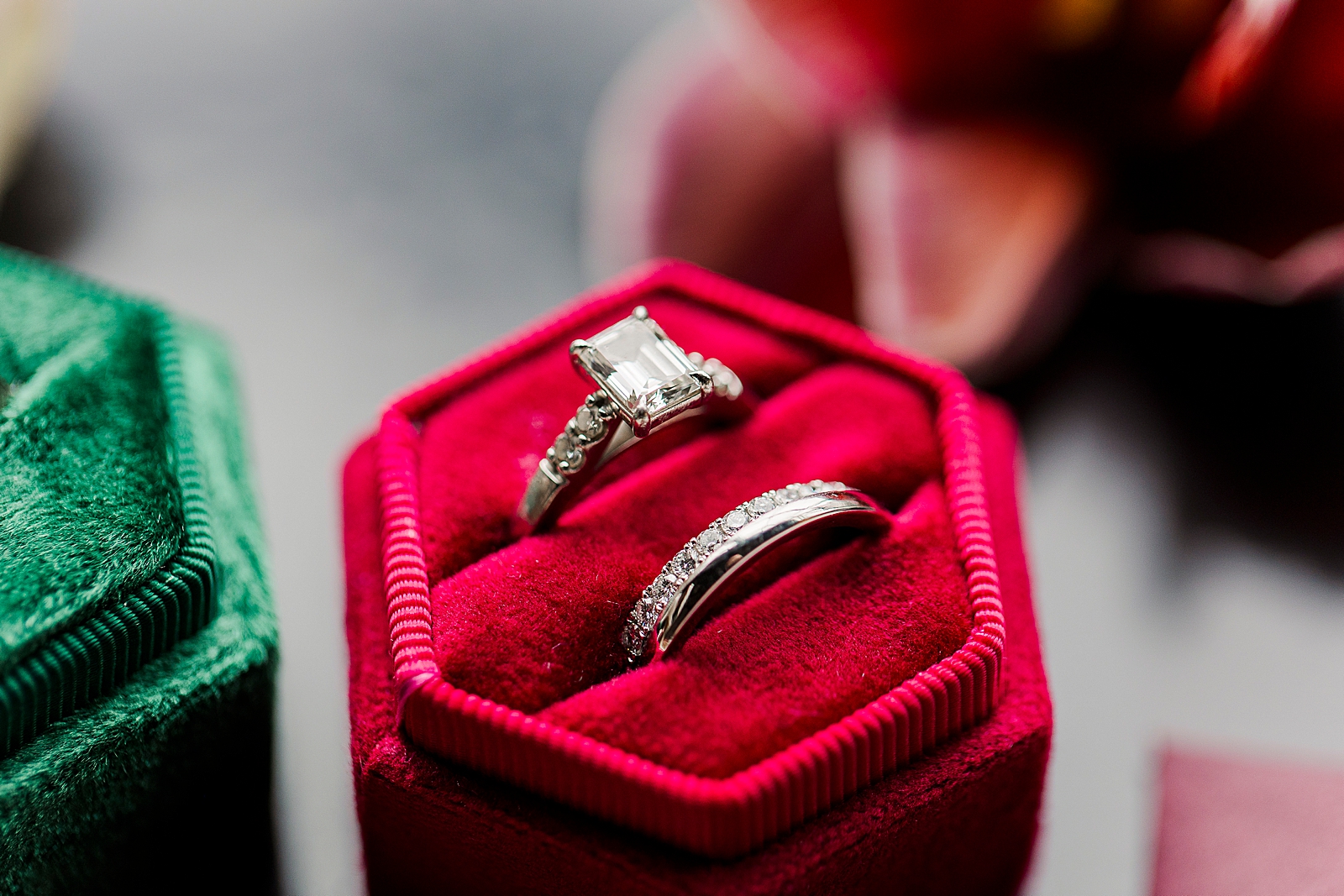 Close up shot of the bride's engagement and wedding rings. 