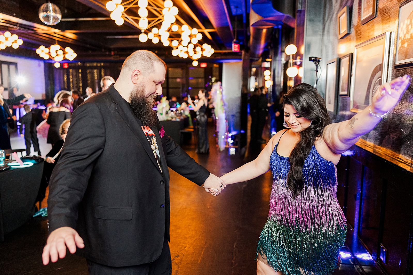 Shot of the bride and groom dancing during their reception. 